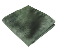 Conjunto de presente com gravata, lenço de bolso e abotoaduras em cetim de seda texturizado verde fosco.