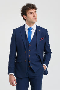 Terno masculino azul-marinho de 3 peças com detalhes em marrom, estampa clássica olho de pássaro vintage, ideal para casamento e noivo.