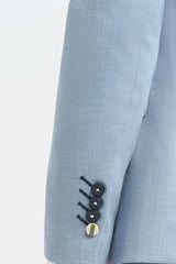 Terno masculino de linho azul-celeste para casamento no verão, com calça azul-marinho.