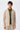 Blazer masculino bege em malha macia, estilo casual elegante.