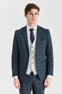 Terno Harris em tweed azul-marinho com colete Belmont prateado contrastante.