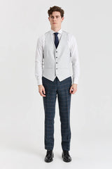 Terno Harris em tweed azul-marinho com colete Belmont prateado contrastante.