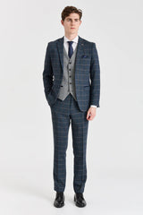 Terno Harris em tweed azul-marinho com colete Harris em tweed cinza contrastante.