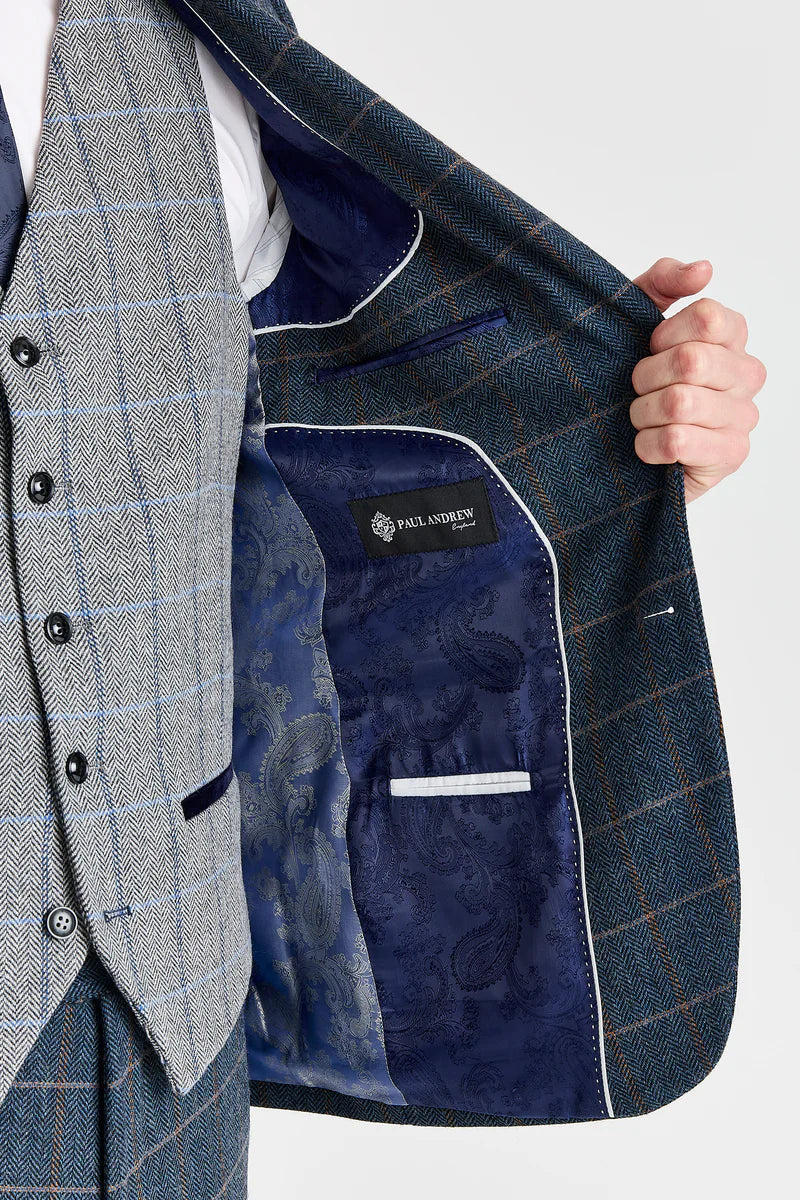 Terno Harris em tweed azul-marinho com colete Harris em tweed cinza contrastante.