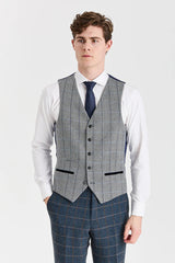 Terno Harris em tweed azul-marinho com colete Harris em tweed cinza contrastante.