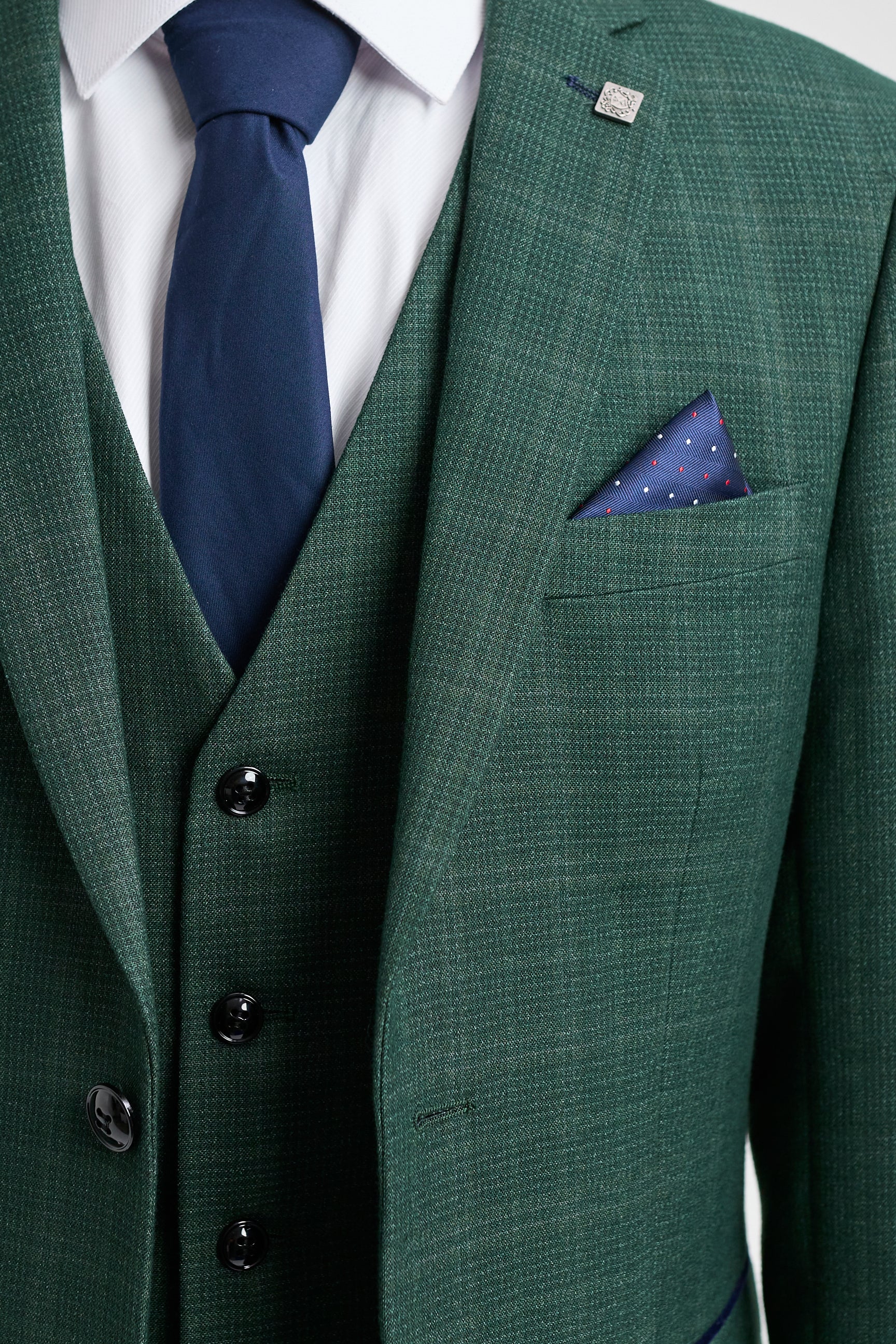 Leo - Terno masculino verde de três peças com estampa xadrez e corte sob medida.