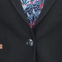 Blazer feminino clássico vintage dos anos 1920 em lã tweed com cotoveleiras, preto.